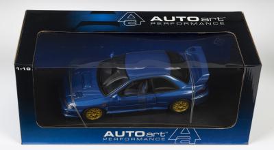 SUBARU: A NOS 1:18 scale Autoart Subaru Impreza 22B die-cast model with opening parts