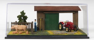 PORSCHE: A NOS 1:43 scale Schuco Porsche Tractor with Farm Diorama die-cast model