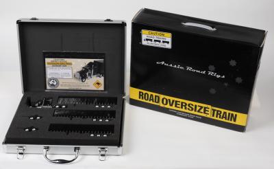 AUSTRALIAN ROAD TRAIN: A NOS 1:64 scale Cooee Collectable Kenworth W900L Truck & 40' Tri-axle Tautliner B-Triple Road Train in Midnight Black die-cast model with Certificate of Authenticity #099/250 in Metal Attache Case & Boxing