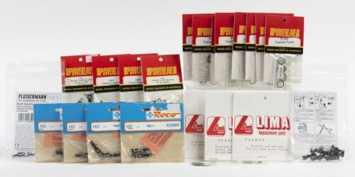 COUPLINGS/TRACTION TYRES: A quantity of NOS Roco/Fleischmann/Powerline Couplings and Powerline/Lima Traction Tyres/Motor Brushes