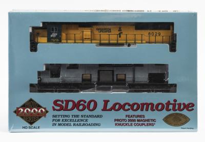 LOCOMOTIVE: A NOS sealed Proto 2000 Electric HO scale Chicago & North Western "Operation Lifesaver" SD60 Locomotive #8029