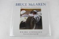 BRUCE McLAREN: 'Bruce McLaren' hardcover book by Karl Ludvigsen. Bruce McLaren signature. CoA
