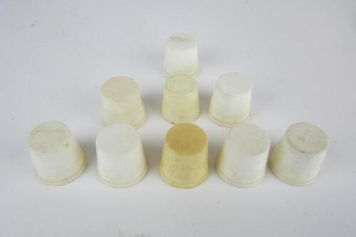 CALTEX: A set of white oil pourer caps.