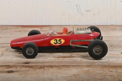 JAPAN: A vintage Japanese friction driven model of an open wheel race car by Nomura Toy Industrial Co., Ltd.