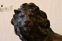 AFTER BARYE: A cast bronze figure of a recumbent lion on black marble base after the original model by Antoine-Louis Barye (French, 1795-1875), 20.5cm high - 2