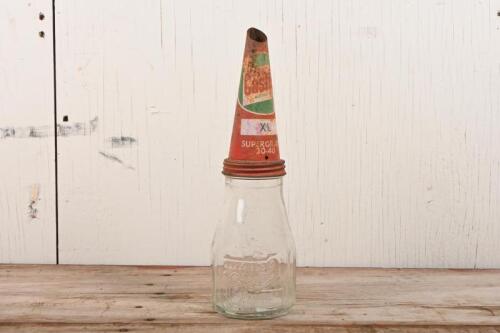 CASTROL: A Castrol 'Wakefield' embossed one imperial pint bottle with Castrol 'XL- Supergrade 30-40' red tin top