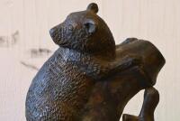BRONZE: A cast bronze figure of a small brush tail mammal on bamboo, on a marble base, 25cm high - 3