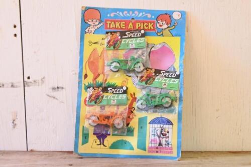 TAKE A PICK: Rare vintage unused "TAKE A PICK" with three unopened bags of 1930s/1940s plastic racing motorcycles by Speed Cycles, made in Hong Kong, cardboard has cut out animals as additional toy, good condition, great for display
