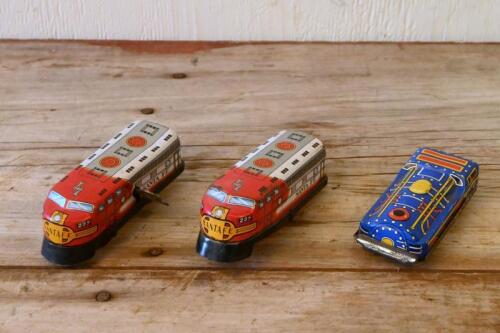 LOCOMOTIVES: Two circa 1960s Japanese lithograph printed tin models of locomotives by Sanko Seisakusho, one clockwork driven, together with another Japanese tin model of a locomotive, longest 10cm