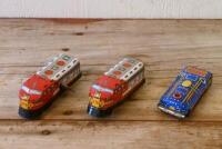 LOCOMOTIVES: Two circa 1960s Japanese lithograph printed tin models of locomotives by Sanko Seisakusho, one clockwork driven, together with another Japanese tin model of a locomotive, longest 10cm