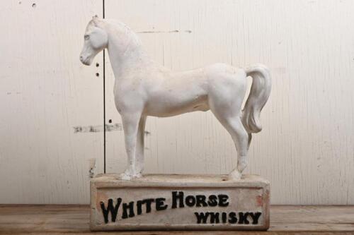 WHITE HORSE WHISKY: An early 20th century White Horse Whisky painted chalkware point of sale advertising figure of a horse, heavily restored around the body, and front legs, crack to rear leg, one ear chipped, 42cm high