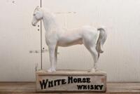 WHITE HORSE WHISKY: An early 20th century White Horse Whisky painted chalkware point of sale advertising figure of a horse, heavily restored around the body, and front legs, crack to rear leg, one ear chipped, 42cm high