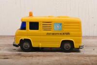 JAPAN: A retro Japanese battery operated plastic model of a service van by Daiya