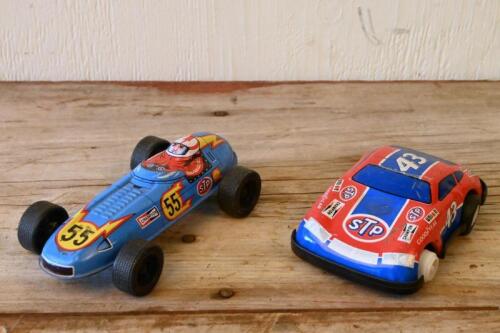 JAPANESE TIN CARS: Two Japanese lithograph printed friction powered tin model cars, longest 14cm long