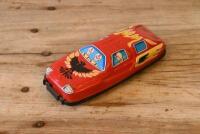 JAPANESE TIN CAR: A circa 1960s Japanese lithograph printed tin race car, 14cm long