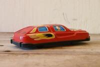 JAPANESE TIN CAR: A circa 1960s Japanese lithograph printed tin race car, 14cm long - 2