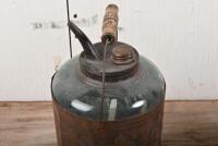 CANS: A vintage rustic red painted petrol can and a "Redkey" iron bound glass oil can, the oil can 32cm high - 3