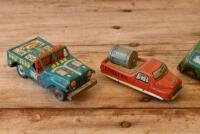 JAPANESE TIN CARS: A collection of four circa 1960s Japanese lithograph printed tin models, including a clockwork tank and Mini Cooper MK II, longest 8.5cm long - 2