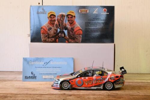 COMMODORE: A limited edition 1:18 scale Classic Carlectables Holden VE Commodore as raced by Craig Lowndes/Mark Skaife in 2010 Supercheap Auto Bathurst 1000 winner, Team Vodafone, with COA numbered 2850/5000, replica trophy included inside, in double fitt