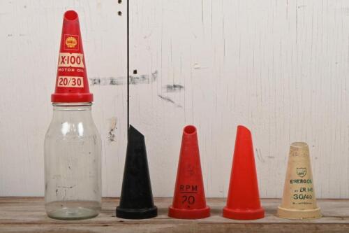 OIL BOTTLE: A one litre oil bottle with "Shell X-100 Motor Oil 20/30" plastic pourer, together with four plastic pourers