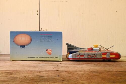UFO: A novelty remote controlled "UFO", together with a vintage lithograph printed futuristic car