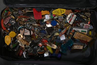 KEYRINGS: A large collection of souvenir and novelty keyrings in a vintage suitcase