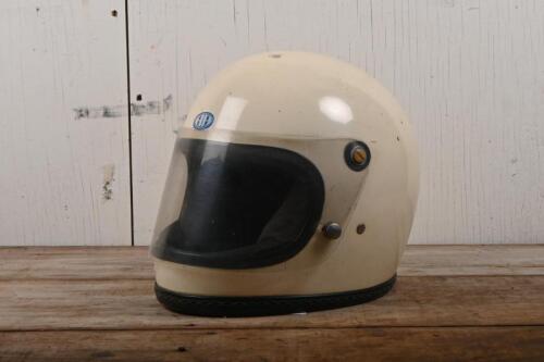 HELMET: A circa 1970s racing helmet, full face with perspex visor