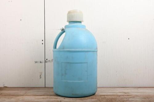 FUEL POURER: A five gallon plastic race car fueler