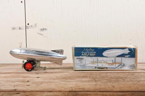GRAF ZEPPELIN: A reproduction wind up toy of the 'Graf Zeppelin' airship made by Schylling