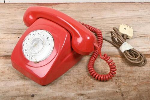 TELEPHONE: A vintage red 'Telecom' rotary dial phone
