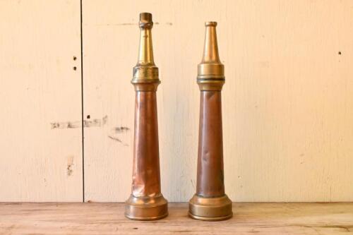 EXTINGUISHER NOZZLES: Two antique brass fire extinguisher nozzles, the largest being 41.5cm tall.
