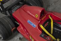 CHILDS CAR: An impressive Italian "Toys Toys" children's battery powered toy car of Alain Prost's 1990 Ferrari F1-90, steel chassis framework with moulded plastic body panels, electric motor, approx 210cm long - 2