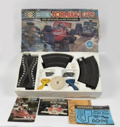 SCALEXTRIC: A circa 1970s Scalextric Formula 1 GP 8 set in box with track plans and extras, lacking motor and general completeness unknown