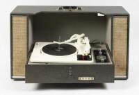 TURNTABLE: A circa 1960s Astor portable turntable and radio, 39cm high, 68cm wide, 24cm deep