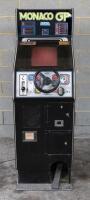 SEGA: A circa 1980 Japanese Sega "Monaco GP" upright single player arcade video game, 145cm high, sound appears to be working, screen is on but is temperamental, pedal appears to work, steering wheel rotates but has no effect, electrical points have oxidi