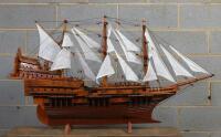 MODEL SHIP: A carved wooden model of a Spanish galleon on stand, 102cm wide - 2
