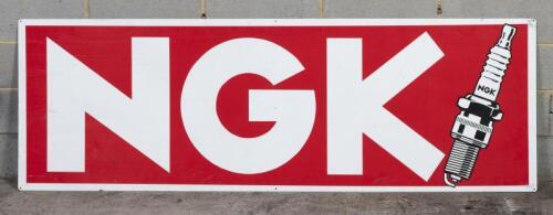 NGK: A large "NGK" spark plug tin sign, 180 x 60cm
