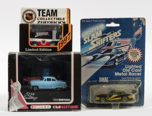 MODEL CARS: Three diecast model cars in boxes