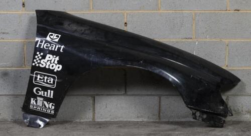 TOURING: A side panel likely from an early 2000s Team Kiwi Racing Holden Commodore VY touring car