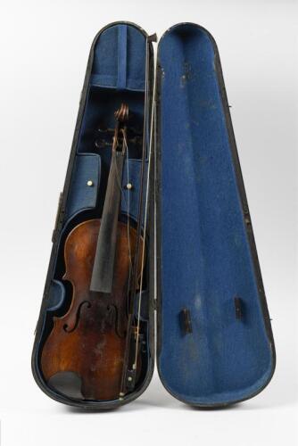 VIOLIN: An early 20th century copy of a Stainer violin in fitted case with printed label to the interior "Jacobus Stainer in Absam prope Oenipontum 16" and stamped to the back "Stainer", with bow and other accessories, no strings and the tailpiece is no l