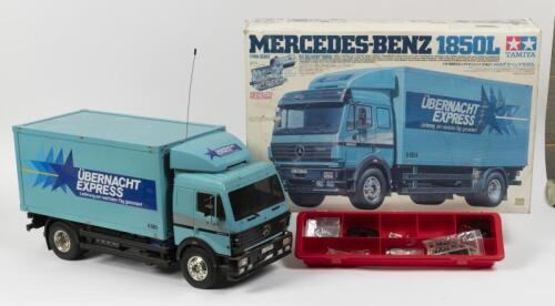 TAMIYA: A large 1/14 scale Mercedes Benz 1850L Remote Control Delivery Truck along with box of spares including tools, stickers and parts.