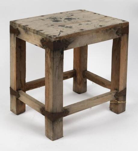 STOOL: A wooden stool with interesting metal motifs