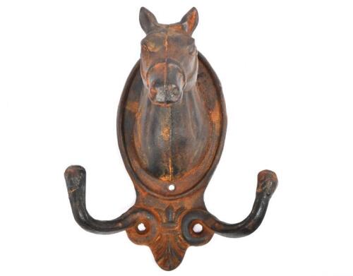 WALL HOOK: A modern cast iron wall mount hook in form of a horses head
