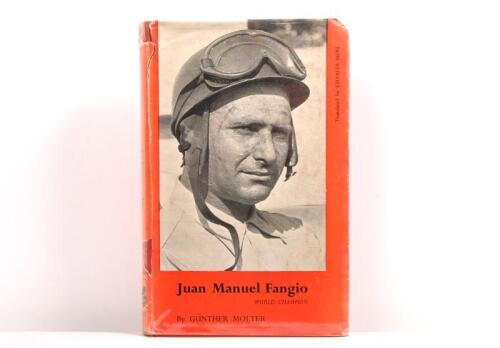 FANGIO: A signed copy of "Juan Manuel Fangio, World Champion" hardcover book by Gunter Molter. Signed in black ink by Juan Manuel Fangio