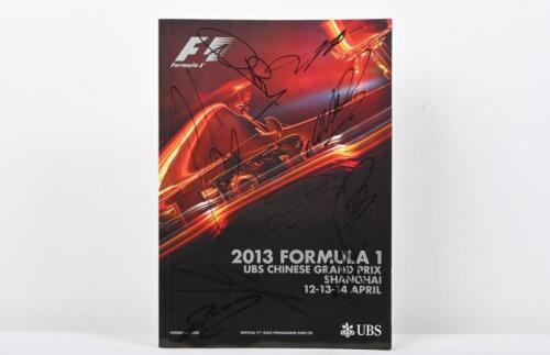 FORMULA 1: An April 2013 UBS CHINESE GRAND PRIX SHANGHAI Official Programme. Front cover of programme signed by numerous F1 drivers including Lewis Hamilton, Nico Rosberg, Sebastian Vettel, Mark Webber