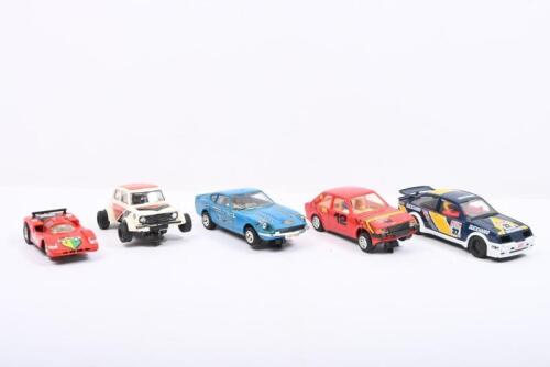 SLOT&nbsp;CARS: A group of five slot cars. SCALEXTRIC & Hornby Hobbies Slot Cars