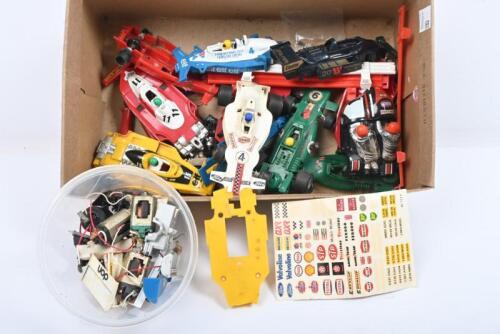 SCALEXTRIC F1: A quantity of SCALEXTRIC F1 parts including F1 car bodies, spare motors, spoiler and associated spare parts