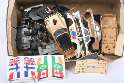 SCALEXTRIC: A quantity of Scalextric parts including car bodies, axles, wheels, chassis