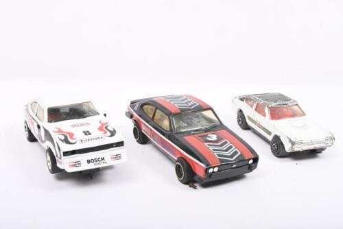 FORD CAPRI: Three Ford Capri models and slot cars. Matchbox FORD CAPRI II (K-59) & CAPRI 3 LITRE SCALEXTRIC Slot Cars