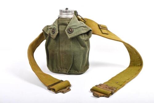 WATER BOTTLE & BELT: An aluminium water bottle and belt, dated 1954, Australian issue